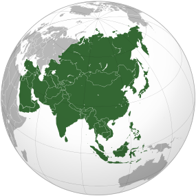 Globe centered on Asia, with Asia highlighted. The continent is shaped like a right-angle triangle, with Europe to the west, oceans to the south and east, and Oceaniato the south-east.