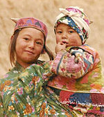 A Turkmen girl and baby from Afghanistan