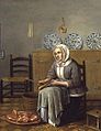 A Seated Woman preparing Food in a Kitchen.jpg