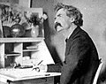 Mark Twain pondering at desk - part.jpg