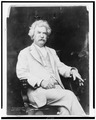 Mark Twain seated with a cigar in his hand.tif