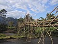 Wooden footbridge in Vang Vieng and blue sky.jpg
